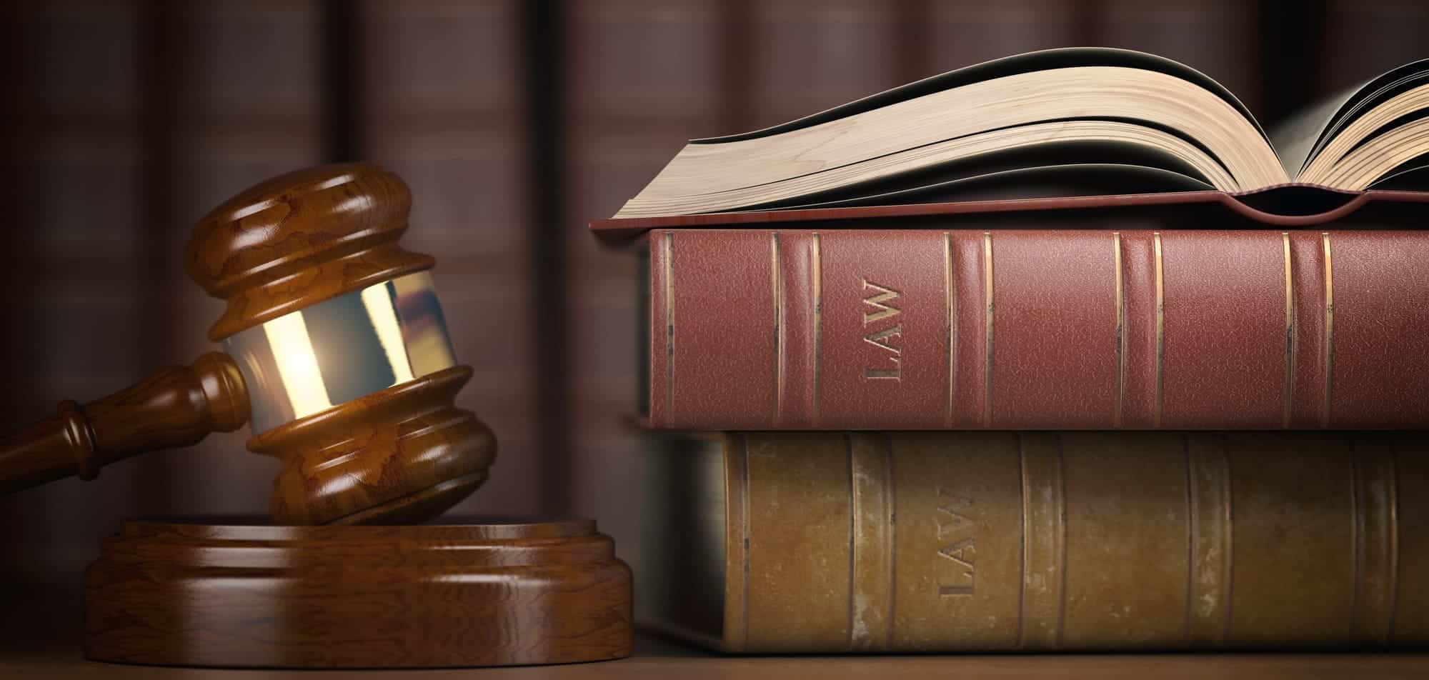 A judge's gavel beside the law books