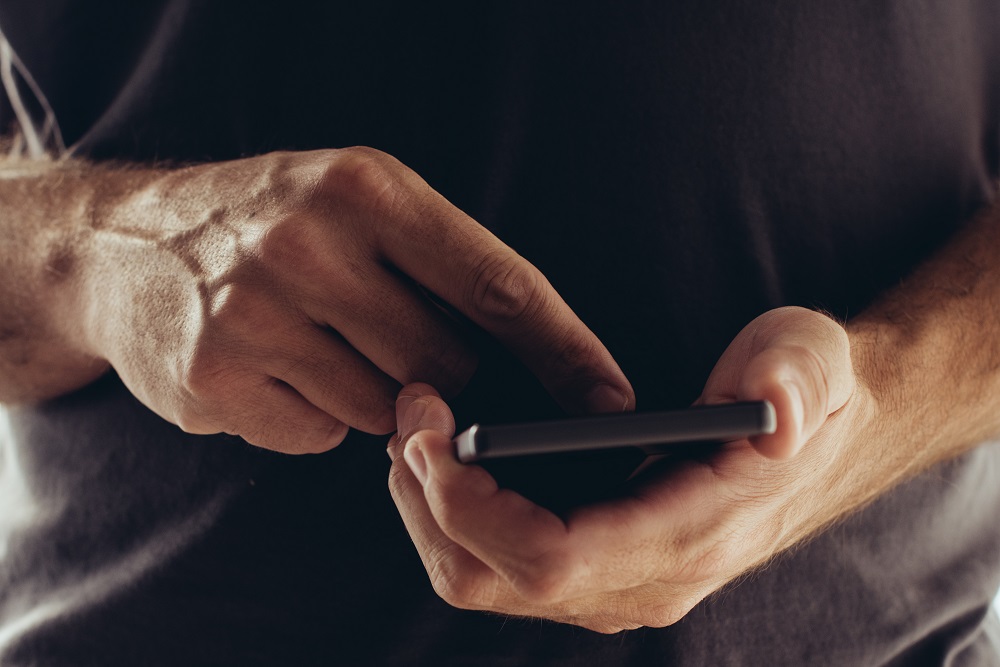 a person holding his phone