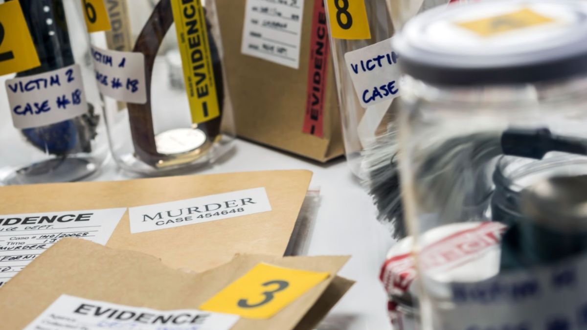 A table with a bottle, a jar, and a piece of paper, illustrating the concept of burden of proof in law.