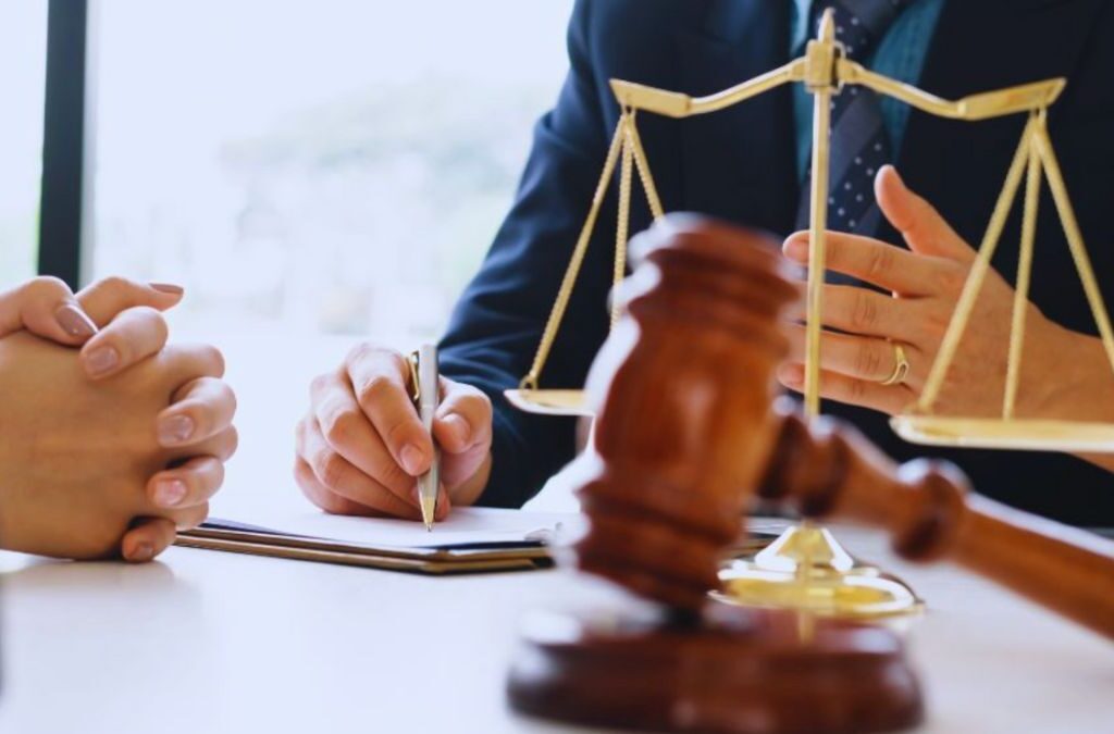 A sexual assault lawyer consulting with a client in an office, emphasizing the importance of legal support during the proceedings.