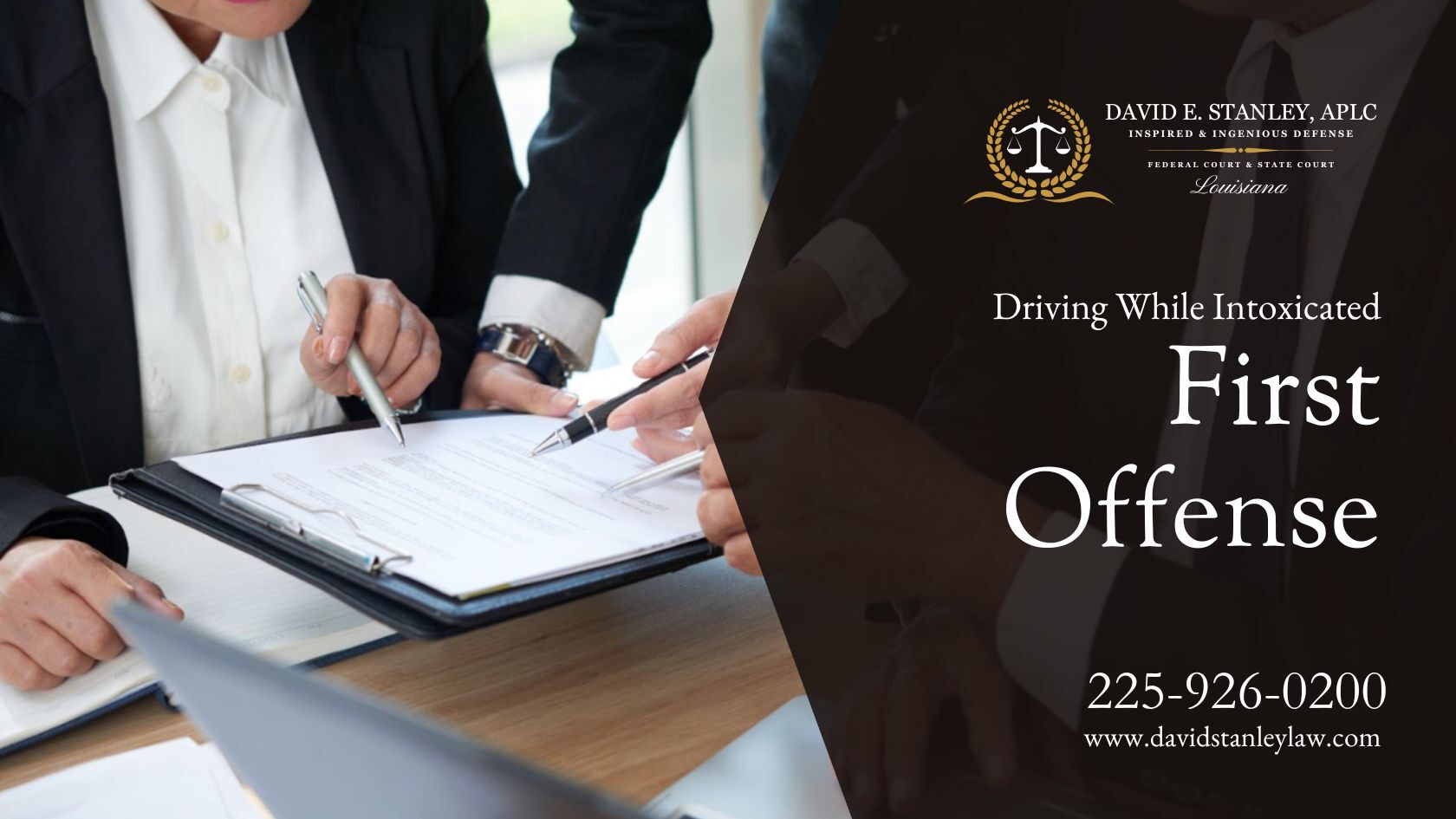 Three legal professionals in suits discussing defense strategies for a DWI-first offense case at David E. Stanley, APLC.