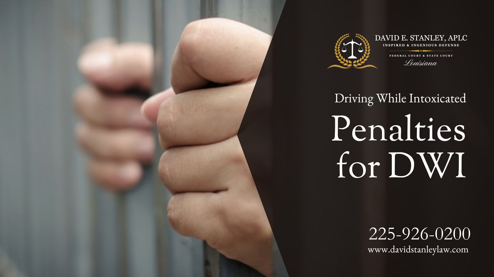 A person's hands gripping the metal bars of a prison cell.