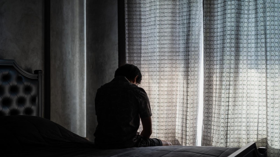 Person sitting quietly at home while under criminal investigation